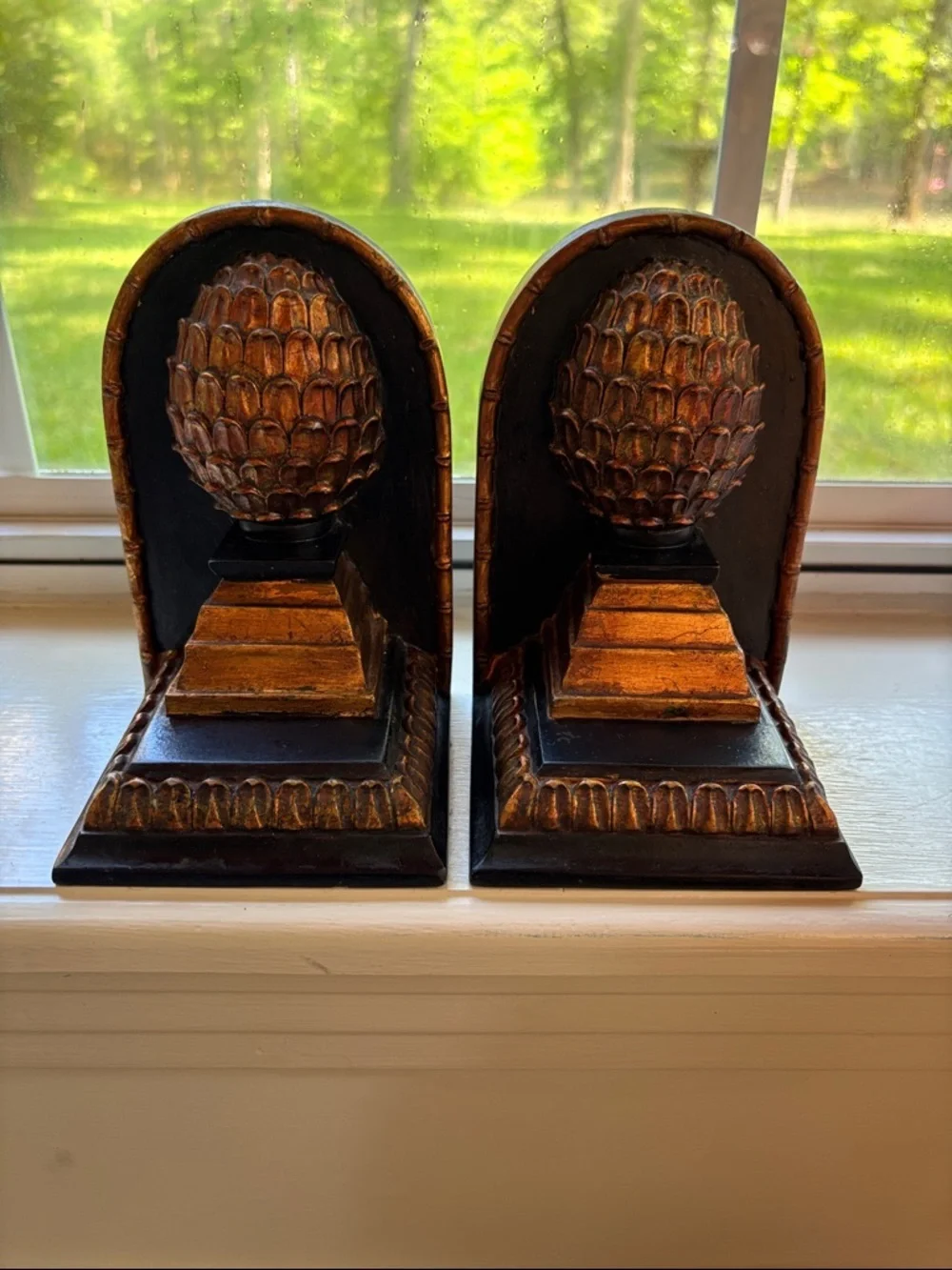 Set Of Bookends Featuring Pineapple Finial Design Atop A Tiered Base.